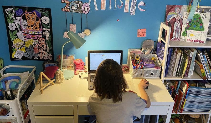 This April 9, 2020, photo released by Kara Illig shows her daughter, Ainslie Illig, 8, on her computer in Ebensburg, Pa. The frustration of parents is mounting as more families across the U.S. enter their second or even third week of total distance learning, and some say it will be their last. (Kara Illig via AP)  **FILE**