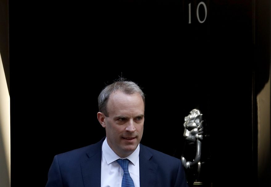 Britain's Foreign Secretary Dominic Raab leaves 10 Downing Street, London, Wednesday April 22, 2020. Dominic Raab will stand in for Prime Minister Boris Johnson at the weekly Prime Minister’s Questions session, who is still recovering from a bout of COVID-19. (AP Photo/Frank Augstein)