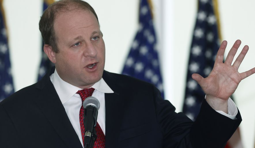 Colorado Governor Jared Polis speaks during a news conference to update the state's efforts to stop the spread of the new coronavirus Wednesday, April 22, 2020, in Denver. (AP Photo/David Zalubowski)