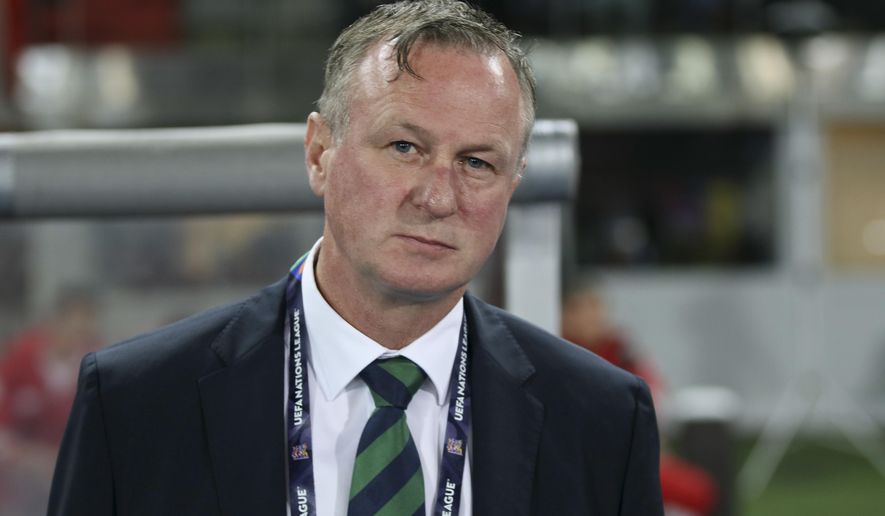 FILE - In this Friday, Oct. 12, 2018 file photo, Northern Ireland coach Michael O'Neill stands prior to the start of the UEFA Nations League soccer match between Austria and Northern Ireland at Ernst Happel stadium in Vienna, Austria. Northern Ireland coach Michael O’Neill left the job on Wednesday April 22, 2020, citing uncertainty over the team’s European Championship playoffs due to the coronavirus pandemic. (AP Photo/Ronald Zak, File)