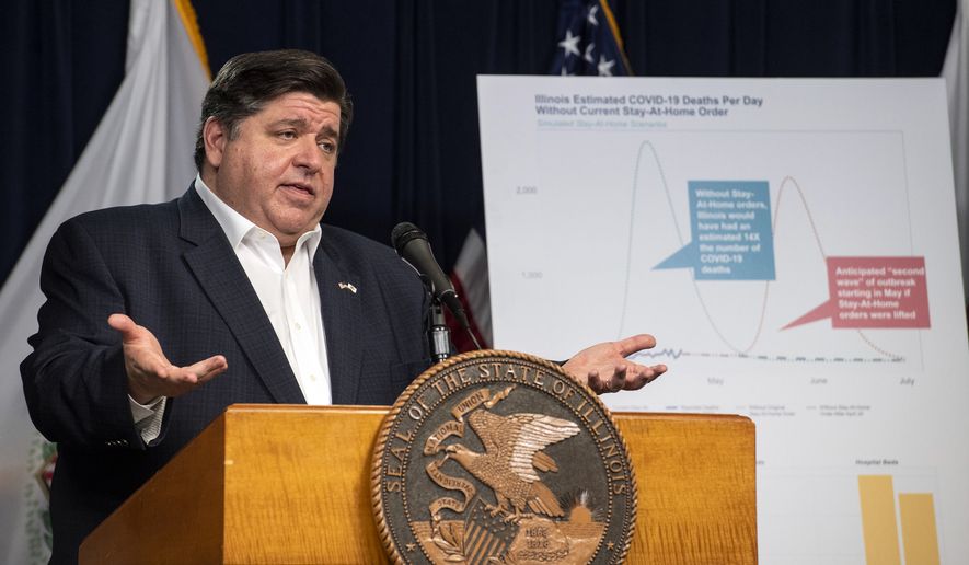 Gov. J.B. Pritzker announces an extension of the stay at home order for Illinois as well as a mandatory face covering order at his daily Illinois coronavirus update at the Thompson Center, Thursday, April 23, 2020, in Chicago. (Tyler LaRiviere/Chicago Sun-Times via AP)
