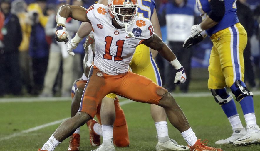 FILE - In this Dec. 1, 2018, file photo, Clemson&#39;s Isaiah Simmons (11) reacts after making a play against Pittsburgh in the first half of the Atlantic Coast Conference championship NCAA college football game in Charlotte, N.C. Simmons is a likely first-round pick in the NFL draft Thursday, April 23, 2020. (AP Photo/Chuck Burton, File)