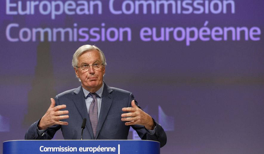 The European Commission&#39;s Head of Task Force for Relations with the United Kingdom Michel Barnier gestures as he speaks during a media conference at EU headquarters in Brussels Friday April 24, 2020. (AP Photo/Olivier Matthys)