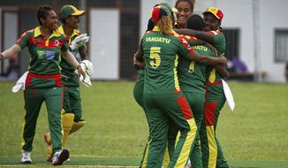 In this May, 2019, photo provided by the Vanuatu Cricket Association players celebrate during a women&#39;s cricket match in Port Vila, Vanuatu. The tropical island in the South Pacific is very likely to be the only venue in the world hosting a competitive cricket final on Saturday, as most international sport remains shuttered around the globe. (Ron Zwiers/Vanuatu Cricket Association via AP)