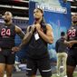 Ohio State defensive lineman Chase Young, center, watches a drill with Alabama defensive lineman Raekwon Davis, left, and Florida defensive lineman Jonathan Greenard, right, at the NFL football scouting combine in Indianapolis, Saturday, Feb. 29, 2020. (AP Photo/Charlie Neibergall) ** FILE **