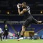 Memphis wide receiver Antonio Gibson runs a drill at the NFL football scouting combine in Indianapolis, Thursday, Feb. 27, 2020. (AP Photo/Michael Conroy)  **FILE**
