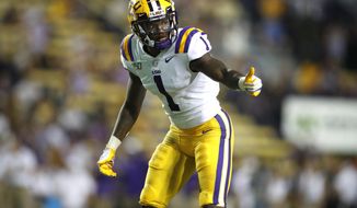 FILE - In this Aug. 31, 2019, file photo, LSU cornerback Kristian Fulton (1) gestures during an NCAA football game against Georgia Southern in Baton Rouge, La. Fulton is a possible pick at the NFL Draft which runs Thursday, April 23, 2020 thru Saturday, April 25. (AP Photo/Tyler Kaufman, File)
