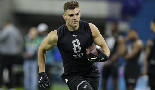 FILE - In this Feb. 27, 2020, file photo, Notre Dame tight end Cole Kmet runs a drill at the NFL football scouting combine in Indianapolis. Kmet was selected by the Chicago Bears in the second round of the NFL football draft Friday, April 24, 2020. (AP Photo/Michael Conroy, File)