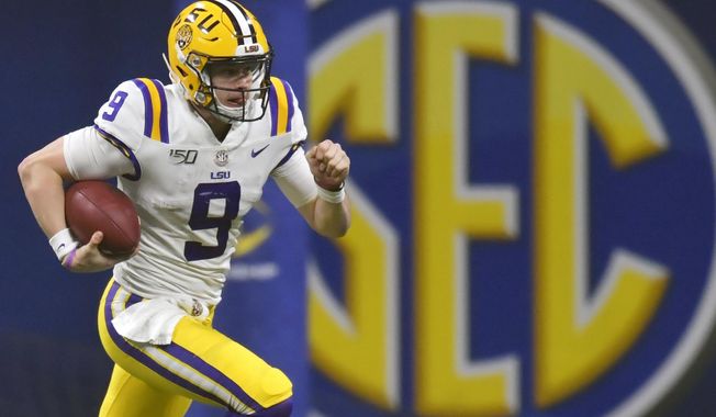 FILE - In this Dec. 7, 2019, file photo, LSU quarterback Joe Burrow (9) runs against Georgia during the second half of the Southeastern Conference championship NCAA college football game, in Atlanta. The Southeastern Conference broke the NFL record for first-round draft picks by a conference. Fifteen players from the powerhouse league were selected in the opening round Thursday night, April 23, 2020. (AP Photo/Mike Stewart, File)