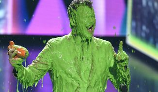 FILE - In this March 23, 2019 file photo, Chris Pratt reacts after getting slimed as he accepts the award for favorite butt-kicker for &amp;quot;Jurassic World: Fallen Kingdom&amp;quot; at the Nickelodeon Kids&#39; Choice Award in Los Angeles. Nickelodeon&#39;s annual show and the signature green slime it pours on celebrities has been rescheduled for May 2 with host Victoria Justice.  On Friday the kids&#39; channel announced that the rebooted virtual ceremony, whose original March 29 date was postponed by the coronavirus, will be known as “Nickelodeon’s Kids’ Choice Awards 2020: Celebrate Together.” (Photo by Chris Pizzello/Invision/AP, file)