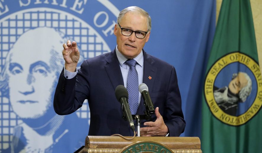 FILE - In this Monday, April 13, 2020, file photo, Washington Gov. Jay Inslee speaks during a news conference at the Capitol in Olympia, Wash. Inslee has repeatedly said he will rely on scientific models and input from state health officials to determine when stay-at-home orders can be relaxed, despite growing calls for them to be ended, including a protest that drew about 2,500 to the state Capitol. (AP Photo/Ted S. Warren, File)