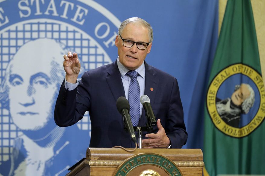 FILE - In this Monday, April 13, 2020, file photo, Washington Gov. Jay Inslee speaks during a news conference at the Capitol in Olympia, Wash. Inslee has repeatedly said he will rely on scientific models and input from state health officials to determine when stay-at-home orders can be relaxed, despite growing calls for them to be ended, including a protest that drew about 2,500 to the state Capitol. (AP Photo/Ted S. Warren, File)