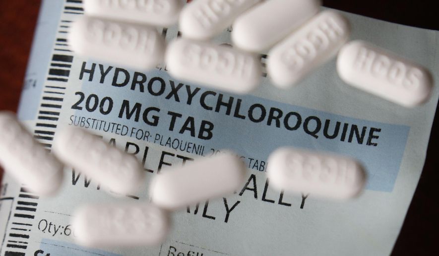 This Monday, April 6, 2020, file photo shows an arrangement of Hydroxychloroquine pills in Las Vegas. (AP Photo/John Locher,File)