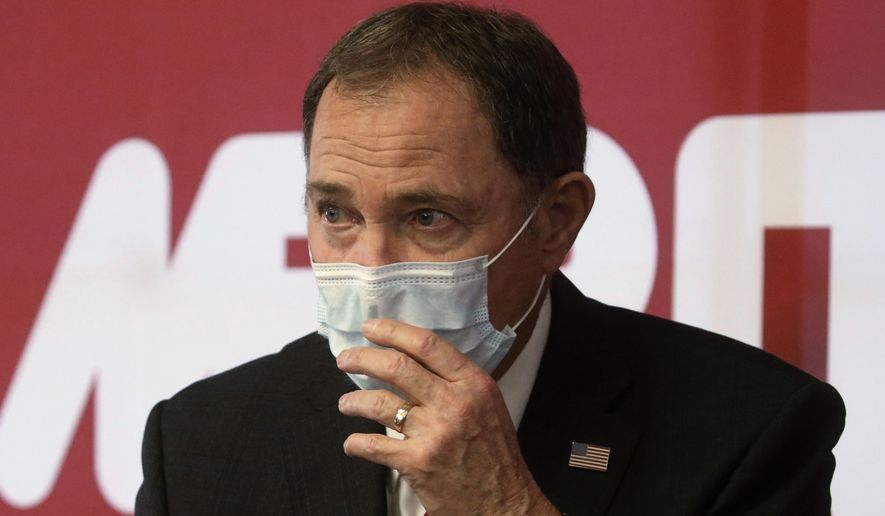 FILE - In this April 21, 2020 file photo Utah Gov. Gary Herbert speaks during a news conference in South Jordan, Utah. Herbert, a Republican, acknowledged that hydroxychloroquine for COVID-19, is "not without controversy," but said an $800,000 purchase from a local company whose CEO appeared alongside GOP lawmakers touting the drugs last month was part of the state's effort to make rational decisions based on "good science and good data." (AP Photo/Rick Bowmer,File)