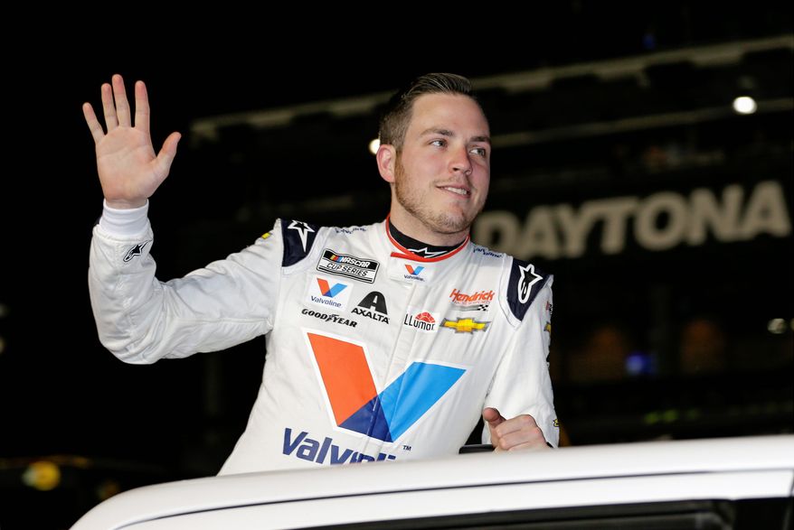 In this Feb. 13, 2020, file photo, Alex Bowman waves to fans during driver introductions before the first of two Daytona 500 qualifying auto races at Daytona International Speedway in Daytona Beach, Fla. Bowman scored his first iRacing victory of NASCAR&#39;s invitational series by holding off Corey LaJoie and Ryan Preece in a two-lap overtime sprint to the finish at virtual Talladega Superspeedway. (AP Photo/Terry Renna, File)  **FILE**


