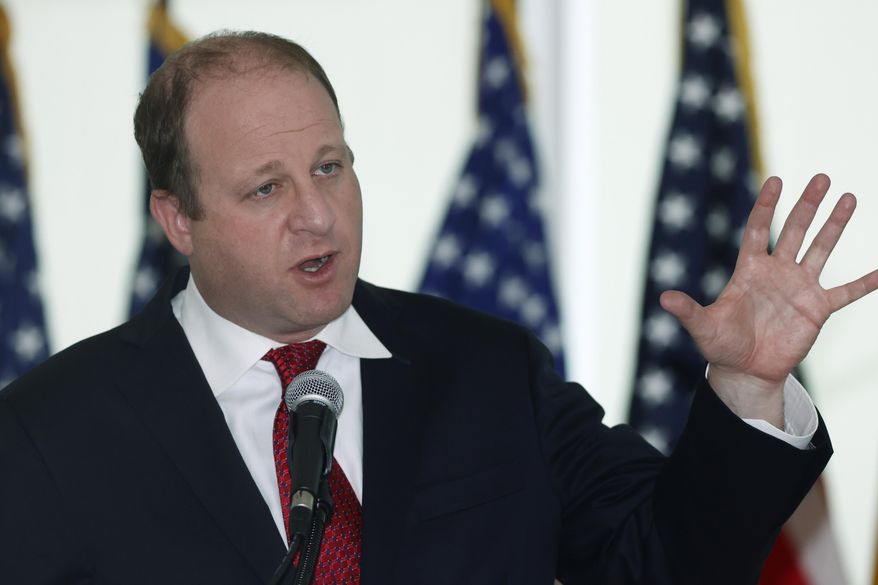 Colorado Governor Jared Polis speaks during a news conference to update the state's efforts to stop the spread of the new coronavirus Wednesday, April 22, 2020, in Denver. (AP Photo/David Zalubowski)