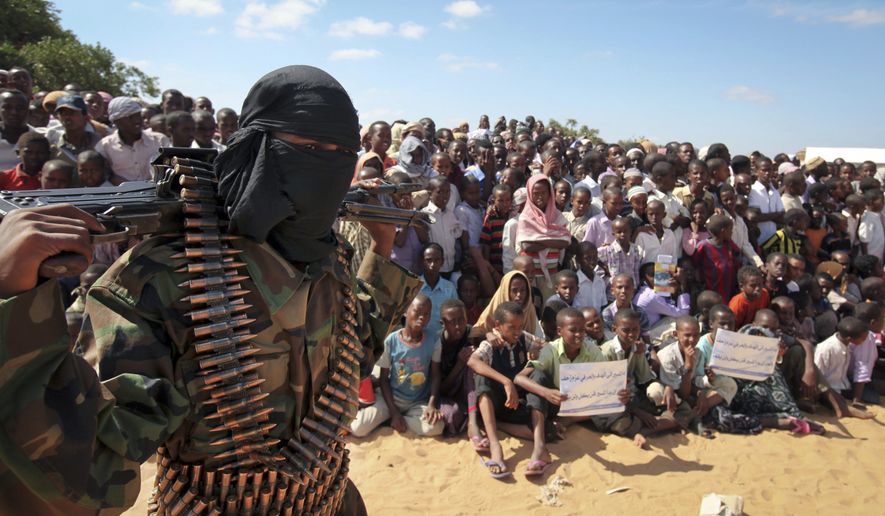 An armed member of the militant group al-Shabaab attends a rally on the outskirts of Mogadishu, Somalia, in this Monday, Feb. 13, 2012, file photo. (AP Photo, File)