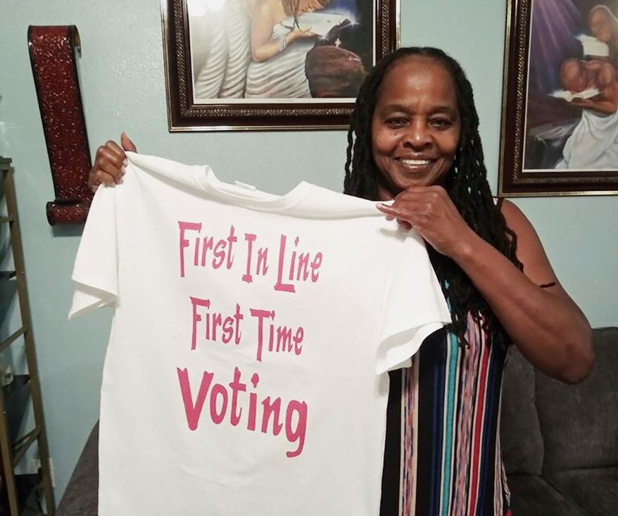 In this photo taken by her son, Betty Riddle in Sarasota, Fla., Sunday, April 26, 2020, holds the T-shirt she wore on March 17, 2020, when she voted for the first time. She was barred from voting in Florida until a federal judge temporarily blocked the state from preventing her and 16 other felons from voting because of unpaid legal financial obligations. (Courtesy of Rickie Riddle via AP)