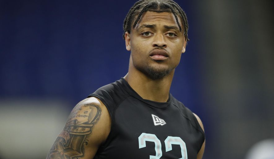 FILE - In this March 1, 2020, file photo, Clemson defensive back A J Terrell watches the 40-yard dash at the NFL football scouting combine in Indianapolis. Terrell is a possible pick in the NFL Draft which runs Thursday, April 23, 2020, thru Saturday, April 25. (AP Photo/Charlie Neibergall, File)