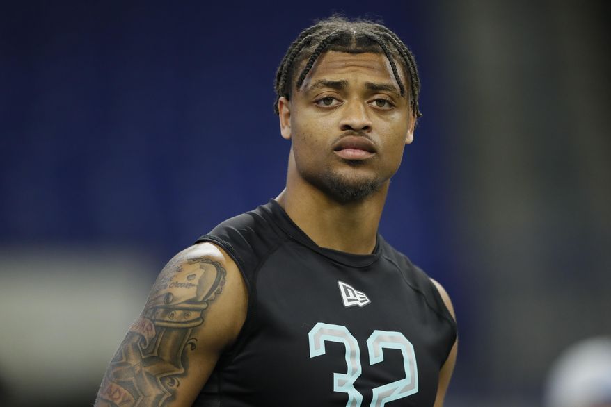 FILE - In this March 1, 2020, file photo, Clemson defensive back A J Terrell watches the 40-yard dash at the NFL football scouting combine in Indianapolis. Terrell is a possible pick in the NFL Draft which runs Thursday, April 23, 2020, thru Saturday, April 25. (AP Photo/Charlie Neibergall, File)