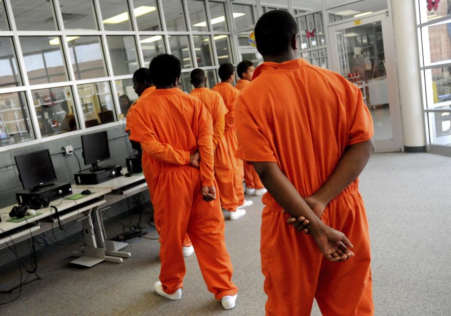 FILE - In this July 8, 2010 file photo, teenagers head toward the gym at Caddo Juvenile Detention Center in Shreveport, La. Fear and frustration is raging as fast as the coronavirus in some juvenile detention centers, with riots and escapes reported in hotspot facilities such as New York and Louisiana. (Val Horvath/The Shreveport Times via AP, File)