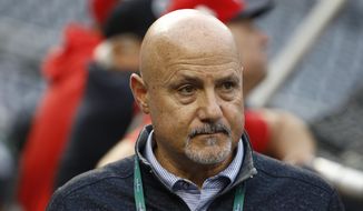  In this Oct. 26, 2019, file photo, Washington Nationals general manager Mike Rizzo watches batting practice for Game 4 against the Houston Astros in the baseball World Series in Washington. “The challenges have been that they stopped playing baseball about six weeks into the spring season,” Rizzo said, talking about the draft. “So that’s been the biggest hurdle that we had to face. Fortunately, we dive into this draft thing very, very seriously. We got a lot done early on, especially the higher-round type of premier prospects. We have a really good feel of what’s out there in the country.” (AP Photo/Patrick Semansky, File)  **FILE**