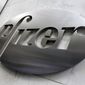 This Monday, Dec. 4, 2017, photo shows the Pfizer company logo at the company&#39;s headquarters in New York.  Pfizer said, Tuesday, April 28, 2020,  the COVID-19 pandemic is disrupting its patient testing of experimental drugs and will reduce revenue significantly in the second quarter, but its manufacturing plants are running normally. (AP Photo/Richard Drew, File)