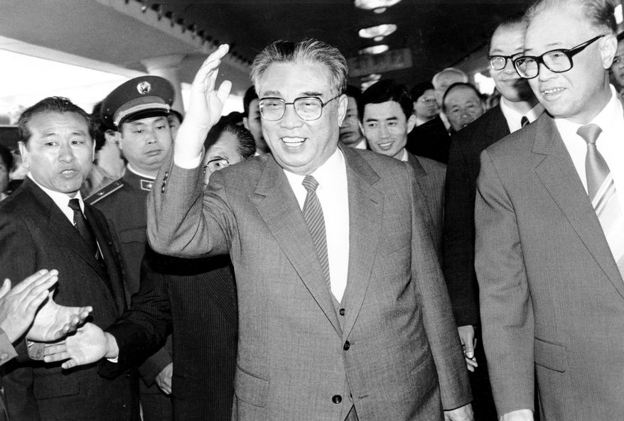 In this May 21, 1987, file photo, then North Korean President Kim Il-sung, center, and then Chinese Premier Zhao Ziyang make their way through a crowd of well-wishers at the train station in Beijing. North Korean leader Kim Jong Un’s two-week absence from public view has inspired speculation and rumors, but past disappearances of North Korea's ruling elite frequently have simply shown the disconnect between insatiable curiosity about the country and the secrecy surrounding its leadership. (AP Photo/Neal Ulevich, File)