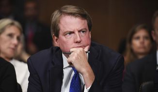 In this Sept. 27, 2018, photo, then-White House Counsel Don McGahn listens as Supreme Court nominee Brett Kavanaugh testifies before the Senate Judiciary Committee on Capitol Hill in Washington. (Saul Loeb/Pool Photo via AP) **FILE**