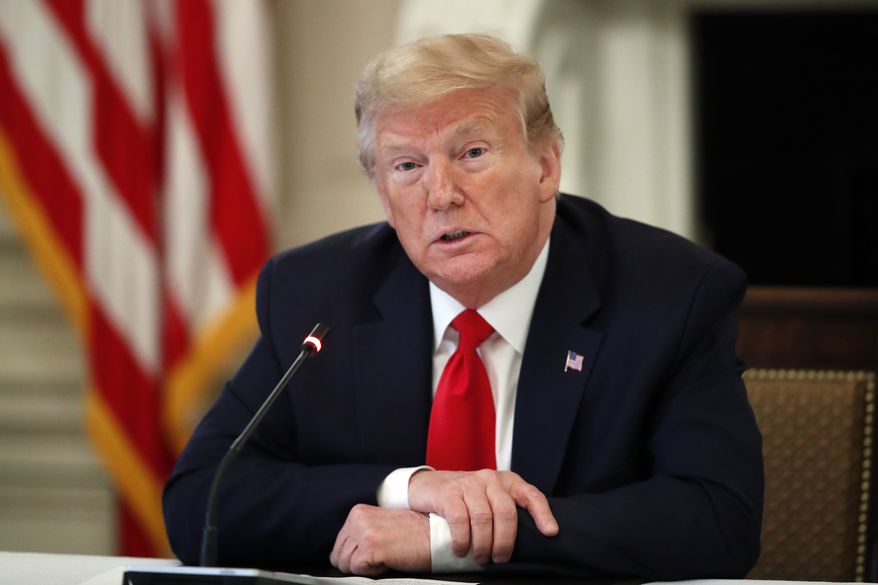 President Donald Trump speaks about reopening the country, during a roundtable with industry executives, in the State Dinning Room of the White House, Wednesday, April 29, 2020, in Washington. (AP Photo/Alex Brandon)
