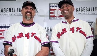  In this Jan. 22, 2020, file photo, former New York Yankees shortstop Derek Jeter, right, and former Colorado Rockies outfielder Larry Walker pose after receiving their Baseball Hall of Fame jerseys during a baseball news conference in New York.  Jeter and Walker and the rest of this year’s Baseball Hall of Fame class will have to wait for their big moment at Cooperstown. The Hall of Fame announced Wednesday, April 29, 2020, that it has canceled its July 26 induction ceremony because of the coronavirus outbreak. (AP Photo/Bebeto Matthews, File)  **FILE**