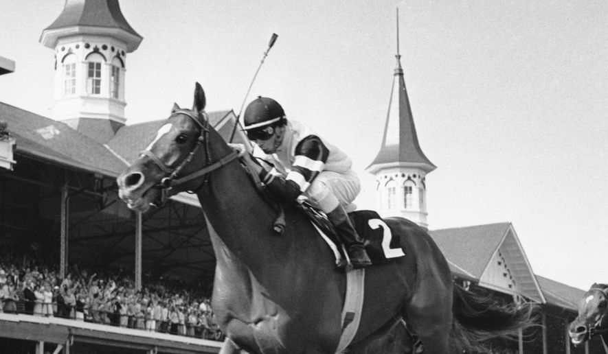 In this May 6, 1978, file photo, Affirmed, jockey Steve Cauthen up, crosses the finish line to win the Kentucky Derby in Louisville, Ky. Secretariat is the early 7-2 favorite for this weekend’s virtual Kentucky Derby, an animated race pitting all 13 Triple Crown winners on the day the Derby would have been held before the coronavirus pandemic postponed it. Citation, who won the 1948 Triple Crown, was made the 4-1 second choice. Seattle Slew and Affirmed, the 1977 and '78 Triple Crown winners, were each listed at 5-1 odds. (AP Photo/File) **FILE**