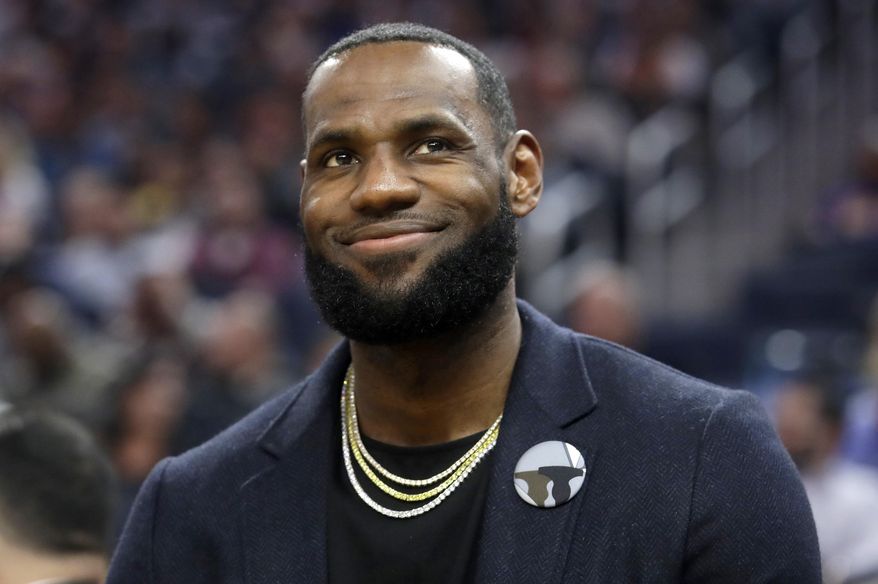 In this Feb. 27, 2020 file photo, Los Angeles Lakers forward LeBron James appears during an NBA basketball game against the Golden State Warriors in San Francisco. Though the coronavirus pandemic has upended graduation season, James is putting together an all-star event to honor and celebrate the Class of 2020. The one-hour special, "Graduate Together: America Honors the High School Class of 2020" will air simultaneously on NBC, ABC, CBS and Fox on May 16 at 8 p.m. EDT. (AP Photo/Jeff Chiu, File) **FILE**