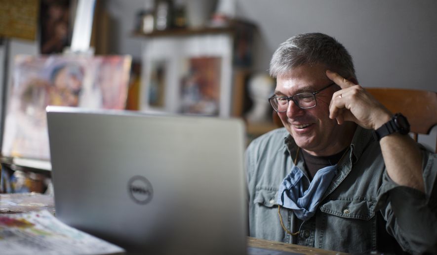 Fred Haag, an associate professor of visual arts at Penn State York, smiles while talking with students during his Art 50: Introduction to Painting course from his farm in Hellam, Pa., Wednesday, April 22, 2020. The spring class of 20 undergraduate students has been meeting remotely since March 16, when the whole Penn State system moved to remote and online classes in response to the COVID-19 outbreak. (AP Photo/Matt Slocum)