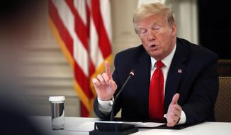 President Donald Trump speaks about reopening the country, during a roundtable with industry executives, in the State Dinning Room of the White House, Wednesday, April 29, 2020, in Washington. (AP Photo/Alex Brandon)