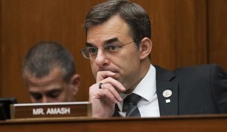 On this June 12, 2019, file photo, Rep. Justin Amash, R-Mich., listens to debate on Capitol Hill in Washington. (AP Photo/J. Scott Applewhite, File)