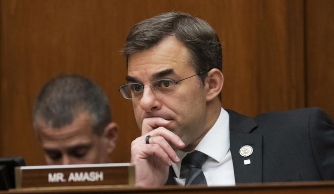 In this June 12, 2019, file photo, Rep. Justin Amash, then a Michigan Republican, listens to debate on Capitol Hill in Washington. Mr. Amash is now calling on anti-Trump Republicans to leave the GOP to become members of the Libertarian Party. (AP Photo/J. Scott Applewhite, File) ** FILE **