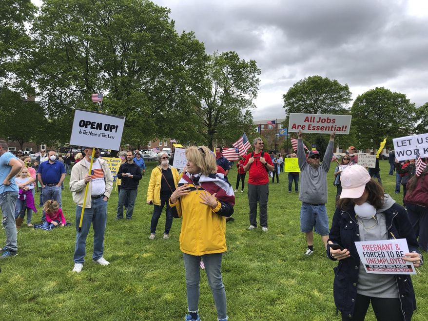 Protesters rally outside Delaware&#39;s Statehouse on Friday, May 1, 2020, in Dover, Del., a demonstration organized by a group called Delawareans Against Excessive Quarantine to demand that Gov. John Carney lift restrictions he has imposed on businesses and individuals in an effort to stem the spread of the coronavirus. A similar rally was held outside the state office building in Wilmington. Carney said the protesters had a right to express their opinion, but that he would have hoped they were more appreciative and supportive of what state officials have done in responding to the virus. (AP Photo/Randall Chase)