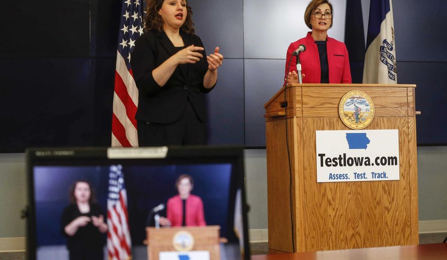 Iowa Gov. Kim Reynolds gave an update on the status of new COVID-19 cases in Iowa during a press conference at the Iowa National Guard in Johnston, Friday, Friday, May 1, 2020. (Bryon Houlgrave/The Des Moines Register via AP, Pool)