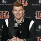 FILE - In this Dec. 29, 2019, file photo, Cincinnati Bengals quarterback Andy Dalton answers questions after his team defeated the Cleveland Browns in an NFL football game in Cincinnati. Dalton is coming home to Texas as Dak Prescott&#39;s backup with the Dallas Cowboys. Dalton and the Cowboys agreed to a one-year deal that guarantees the former Cincinnati starter $3 million and could be worth up to $7 million, two people with direct knowledge of the deal told The Associated Press on Saturday, May 2, 2020. (AP Photo/Gary Landers, File)