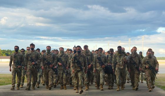 In this photo provided by the U.S. Army, members of Fort Bragg&#39;s 82nd Airborne Division&#39;s Immediate Response Force return Friday, May 1, 2020, at Pope Army Airfield, in North Carolina. The paratroopers suddenly deployed in January amid rising tensions with Iran. (U.S. Army via AP) **FILE**