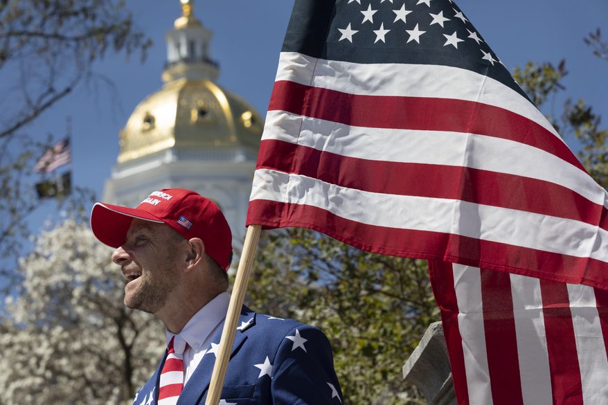 Dan Stolworthy demonstrates against business closures due to concern about COVID-19, Saturday, May 2, 2020, at the State House in Concord, N.H. (AP Photo/Michael Dwyer)
