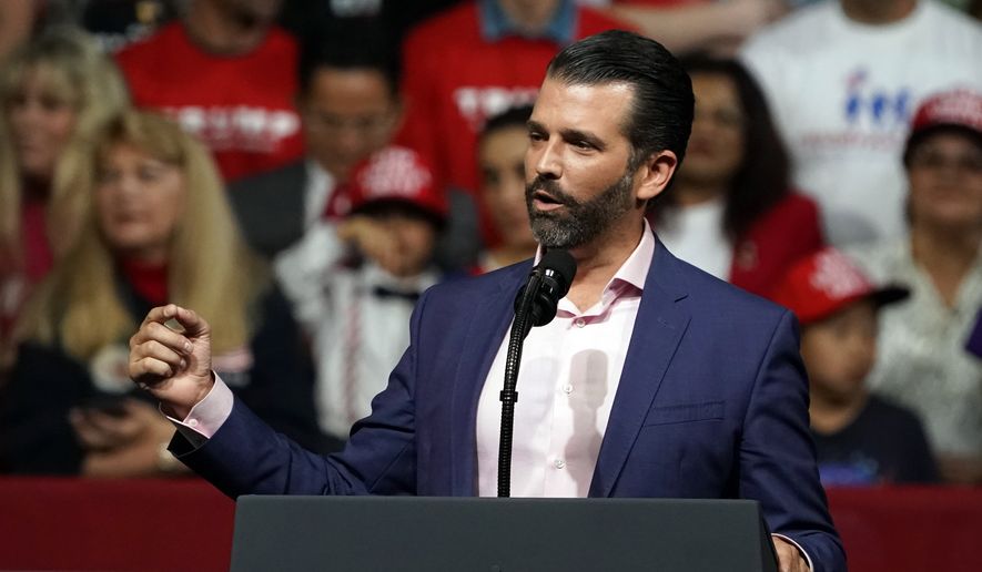  Donald Trump Jr. speaks at a rally before his dad and President Donald Trump appears in Phoenix, Feb. 19, 2020. (AP Photo/Rick Scuteri) ** FILE ** 