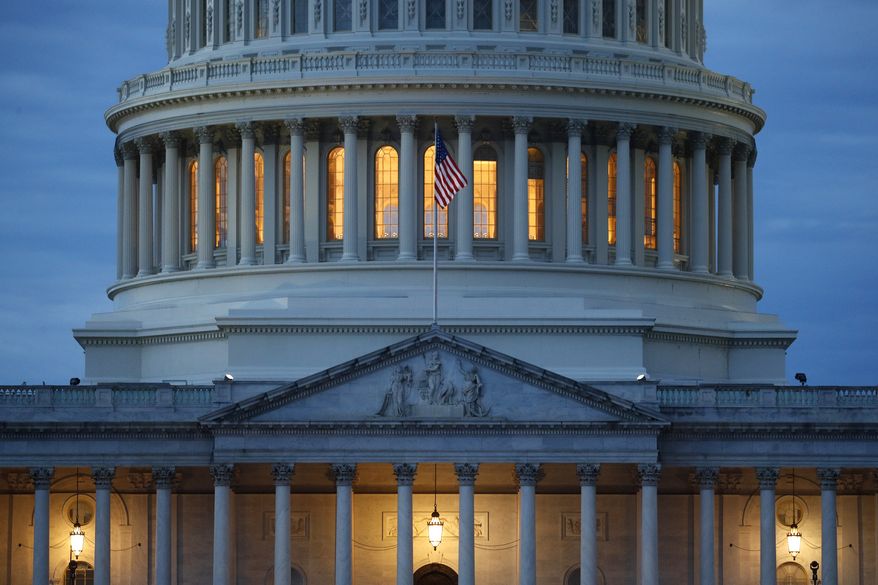 In this May 3, 2020 photo, light shines from inside the U.S. Capitol dome at dusk on Capitol Hill in Washington. The Senate is set to resume Monday, May 4. (AP Photo/Patrick Semansky)