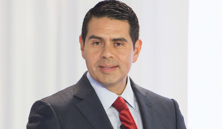This April 9, 2018, image released by Telemundo shows Cesar Conde Chairman of NBCUniversal International Group and NBCUniversal Telemundo Enterprises speaking at the new Telemundo Center during the ribbon-cutting ceremony in Miami. NBC News chief Andy Lack is out following a corporate restructuring announced Monday that places Conde in charge of NBC News, MSNBC and CNBC. Lack&#x27;s departure was revealed when Jeff Shell, new NBC Universal CEO, outlined a new corporate governance plan. (Jesus Aranguren/Telemundo via AP)