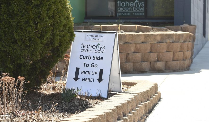 Flaherty's Arden Bowl in Arden Hills has curb-side food pickup, Wednesday, April 22, 2020. The business is struggling to make ends meet, and say they have lost a half million dollars in revenue and have laid off most of the fifty employees. (Scott Takushi / Pioneer Press via AP)