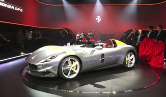 FILE - In this Sept. 18, 2018 file photo, the Ferrari Monza SP1 car is displayed in Maranello, Italy. Luxury sports carmaker Ferrari on Monday, May 4, 2020, significantly lowered full-year earnings guidance due to the COVID-19 pandemic, but acknowledged that the new outlook assumes a sharp recovery in the second half of the year.  (AP Photo/Collen Barry, file)