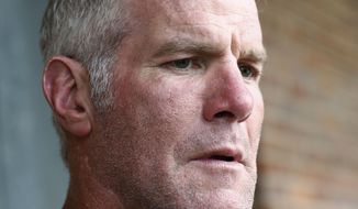 In this Oct. 17, 2018, file photo, former NFL quarterback Brett Favre speaks with reporters in Jackson, Miss., about his support for Willowood Developmental Center, a facility that provides training and assistance for special needs students,T he Mississippi state auditor’s office said in a report it released Monday, May 4, 2020, that a nonprofit group used welfare money to pay $1.1 million to Favre for multiple speaking engagements but Favre did not show up for the events. Favre was paid $500,000 in December 2017 and $600,000 in June 2018, according to an audit of the Mississippi Department of Human Services. Favre is not charged with any wrongdoing. (AP Photo/Rogelio V. Solis, File)
