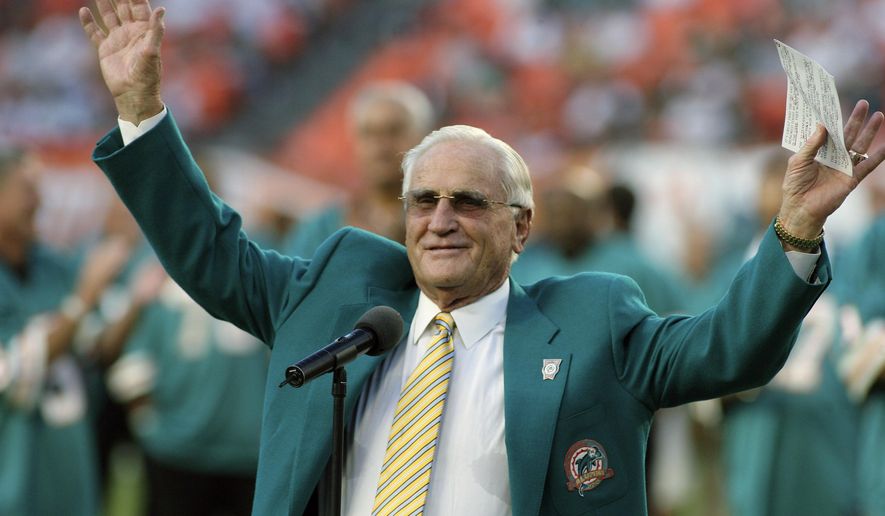 FILE - In this Oct. 25, 2009, file photo, former Miami Dolphins head coach Don Shula waves to the crowd during a half time ceremony of an NFL football game between the Miami Dolphins and the New Orleans Saints in Miami. Shula, who won the most games of any NFL coach and led the Miami Dolphins to the only perfect season in league history, died Monday, May 4, 2020, at his South Florida home, the team said. He was 90.  (AP Photo/Jeffrey M. Boan)