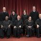 In this Nov. 30, 2018, file photo, the justices of the U.S. Supreme Court gather for a formal group portrait to include the new Associate Justice, top row, far right, at the Supreme Court building in Washington. Seated from left: Associate Justice Stephen Breyer, Associate Justice Clarence Thomas, Chief Justice of the United States John G. Roberts, Associate Justice Ruth Bader Ginsburg and Associate Justice Samuel Alito Jr. Standing behind from left: Associate Justice Neil Gorsuch, Associate Justice Sonia Sotomayor, Associate Justice Elena Kagan and Associate Justice Brett M. Kavanaugh. (AP Photo/J. Scott Applewhite, File)